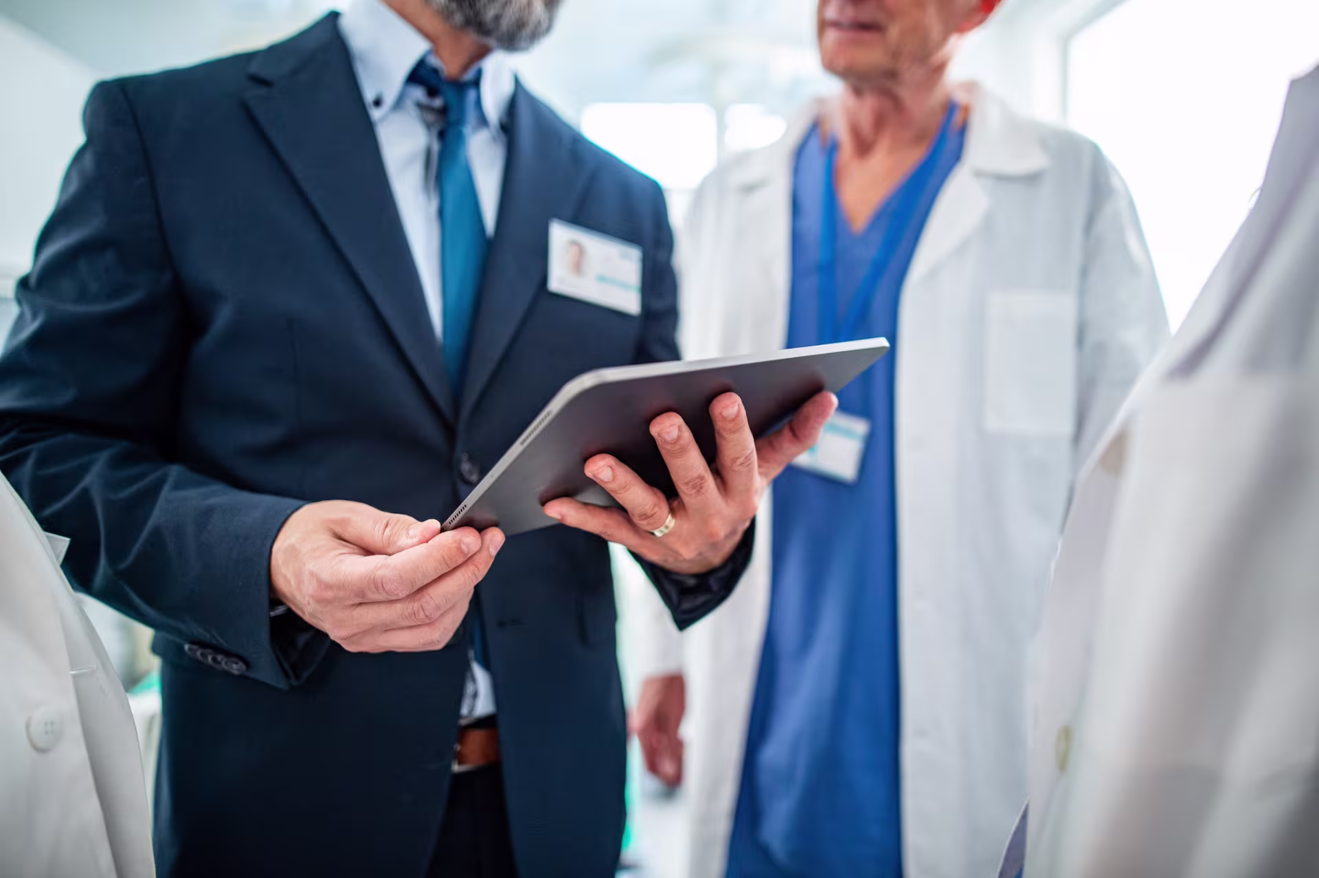 Hospital manager and doctor in conversation.