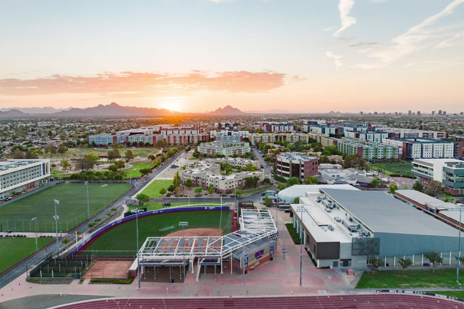 Sunrise aerial view near the military-friendly institution of GCU in Phoenix, AZ, detailing baseball fields to the dorms on the east side of campus.