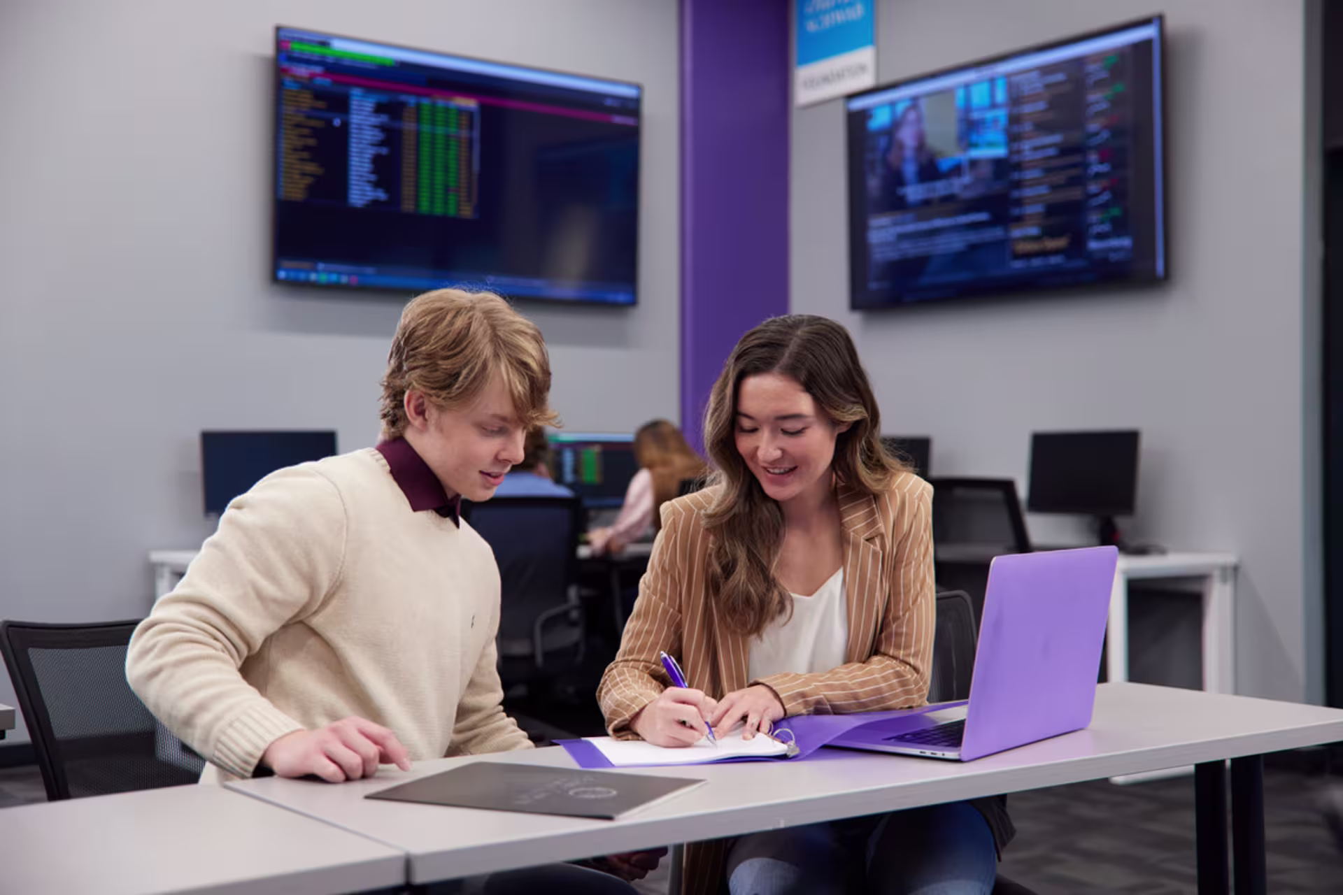 Data science students collaborating during a class.