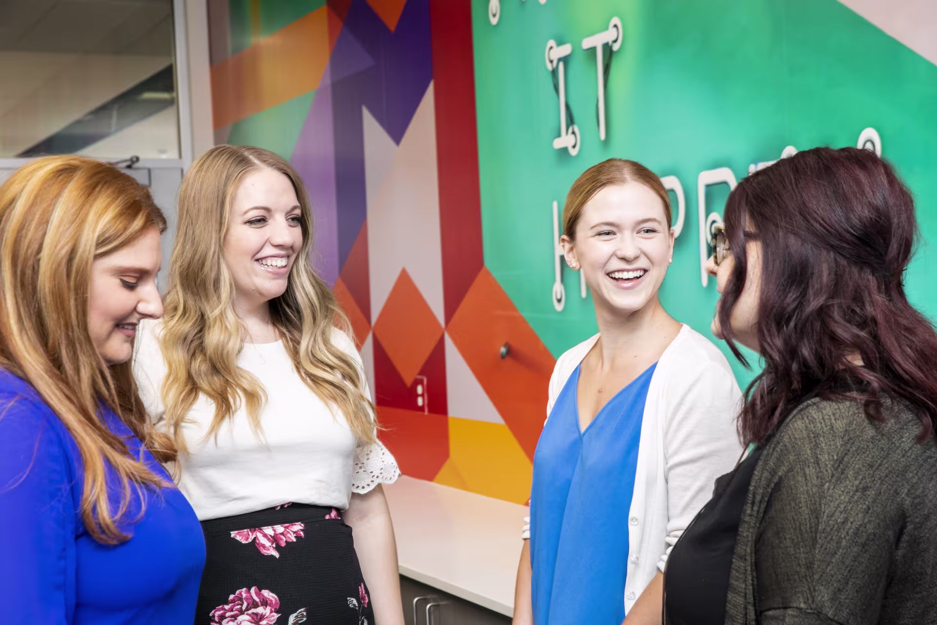 Students talking to each other in a group.