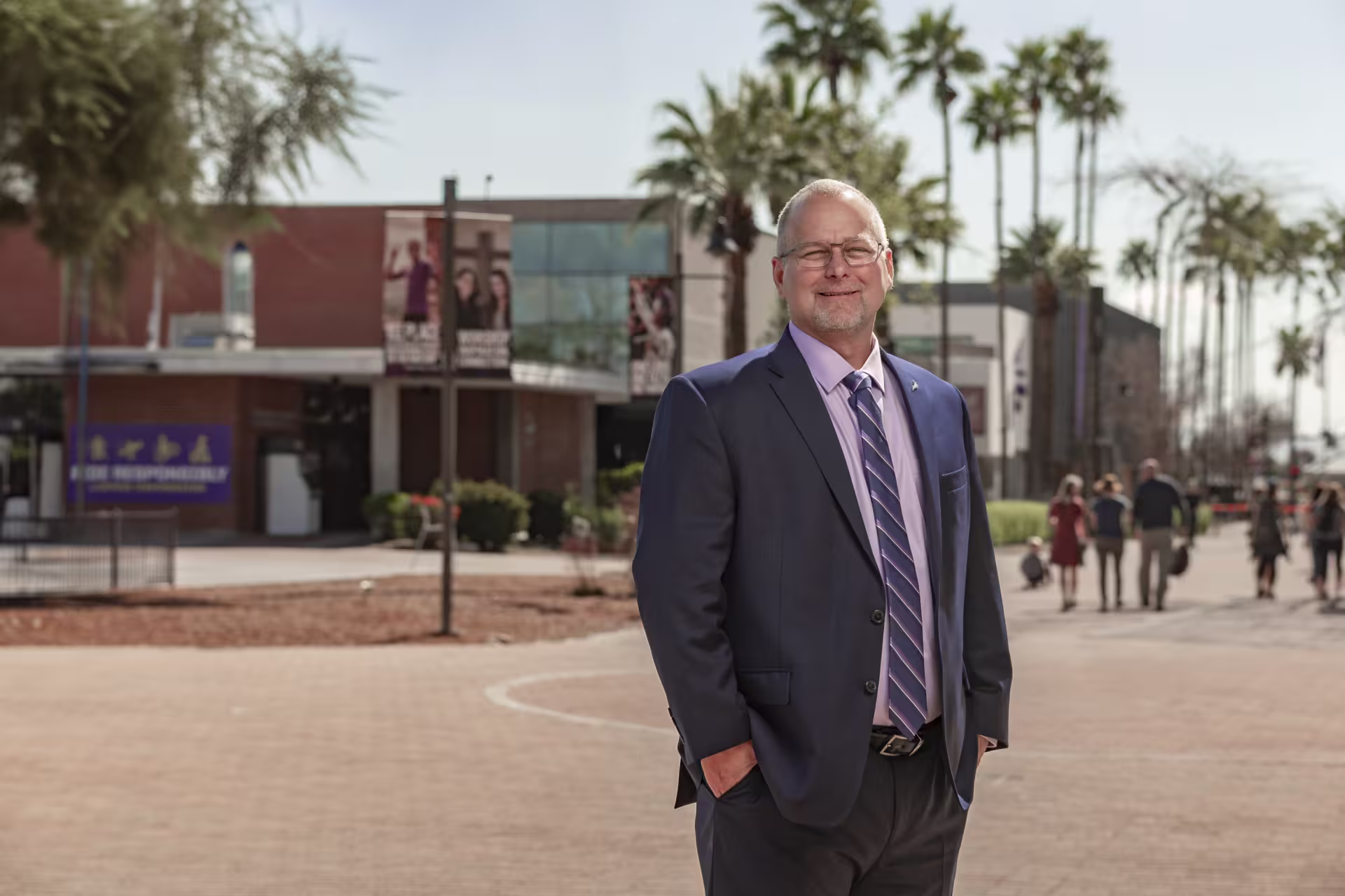 Man standing in the middle of GCU in suit