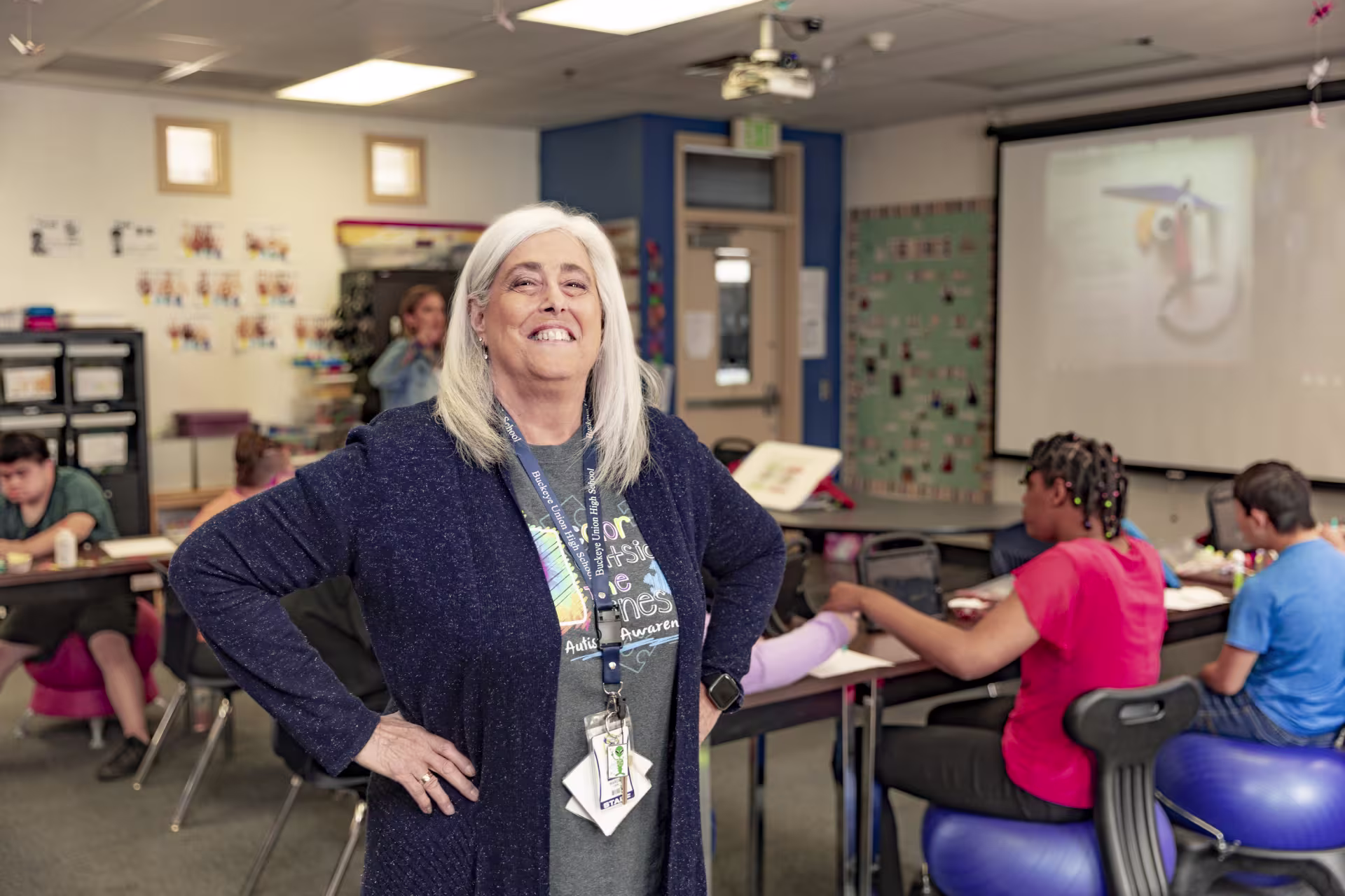 Female special education teacher smiles in classroom