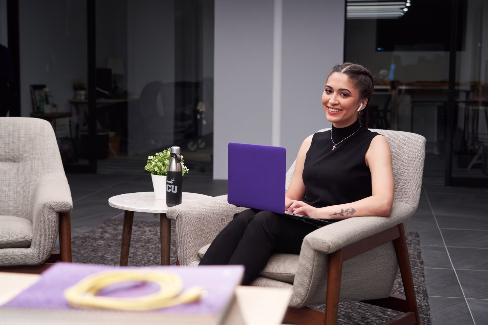 Female cybersecurity student earning master’s online in office