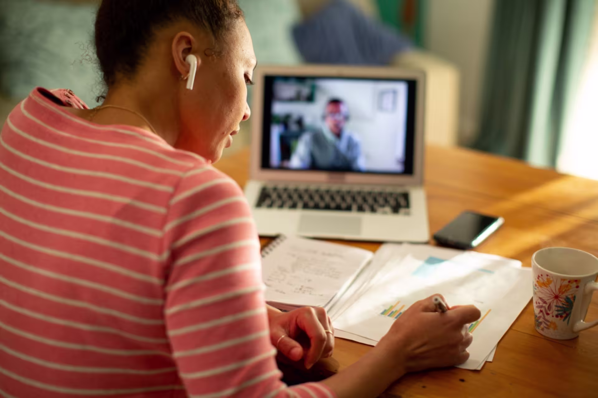 Online learning DBA student in a class discussion on a laptop. 