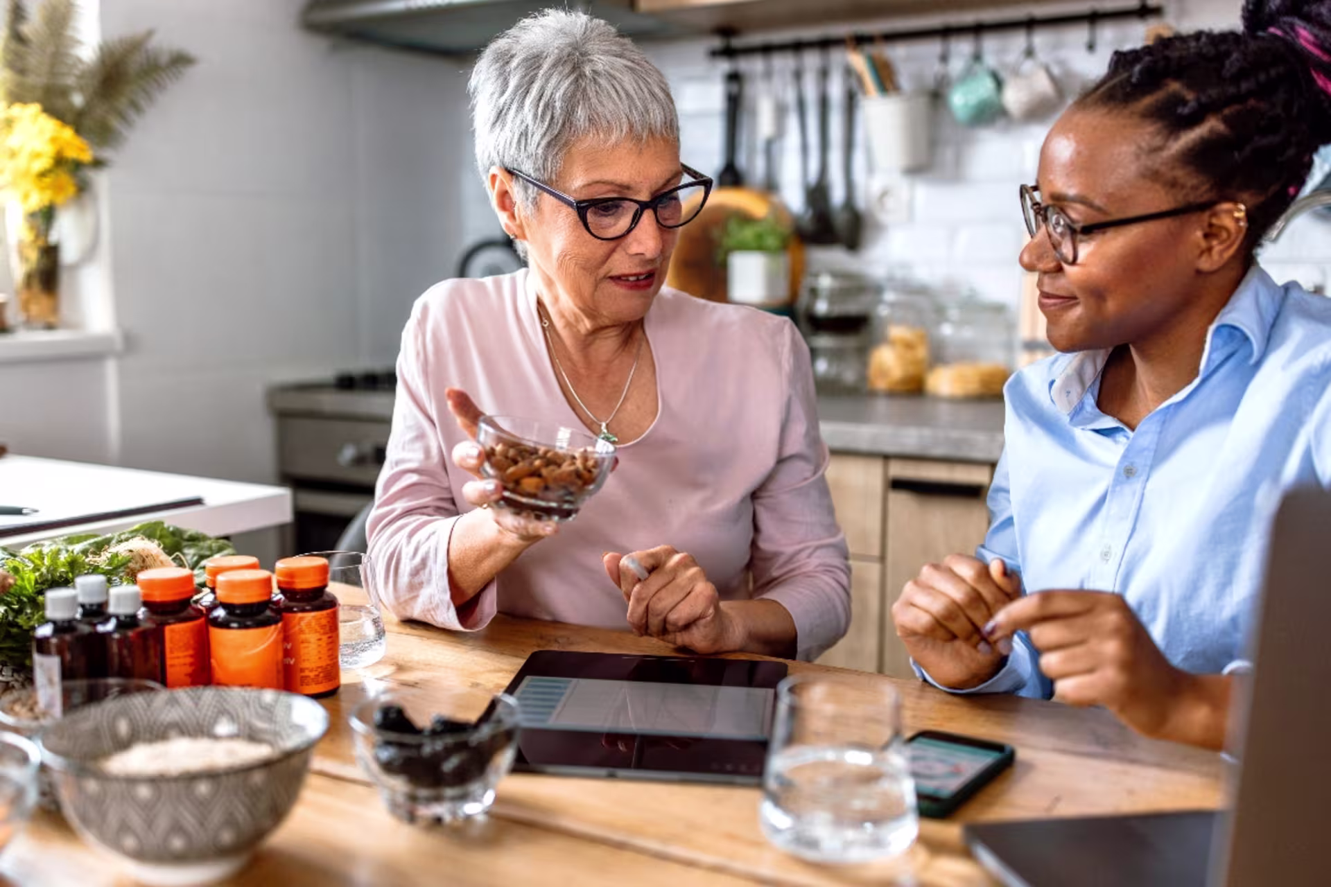 A dietitian teaches a client about the benefits of healthy eating and meal planning.