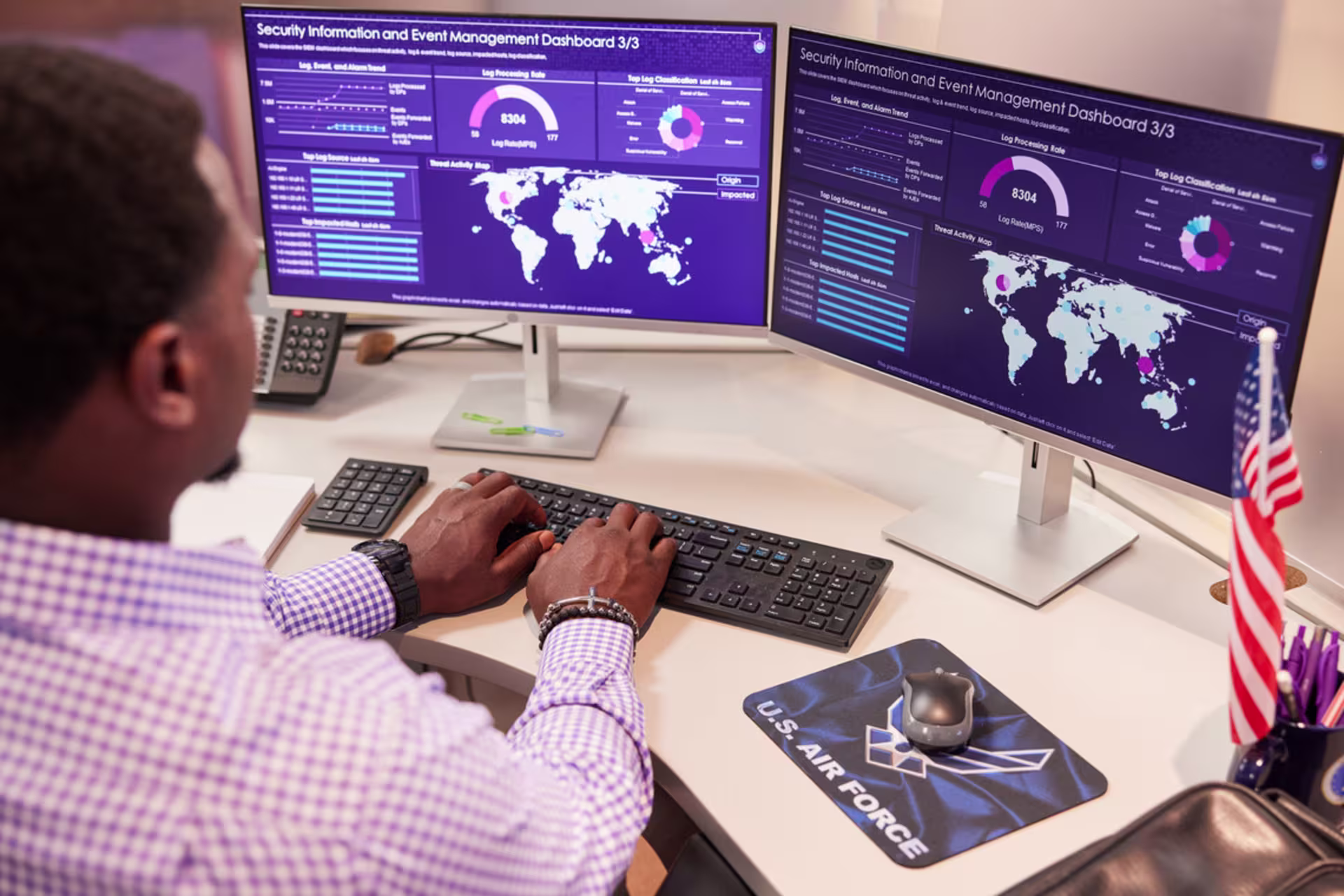 GCU cybersecurity student works on a computer, doing online coursework.