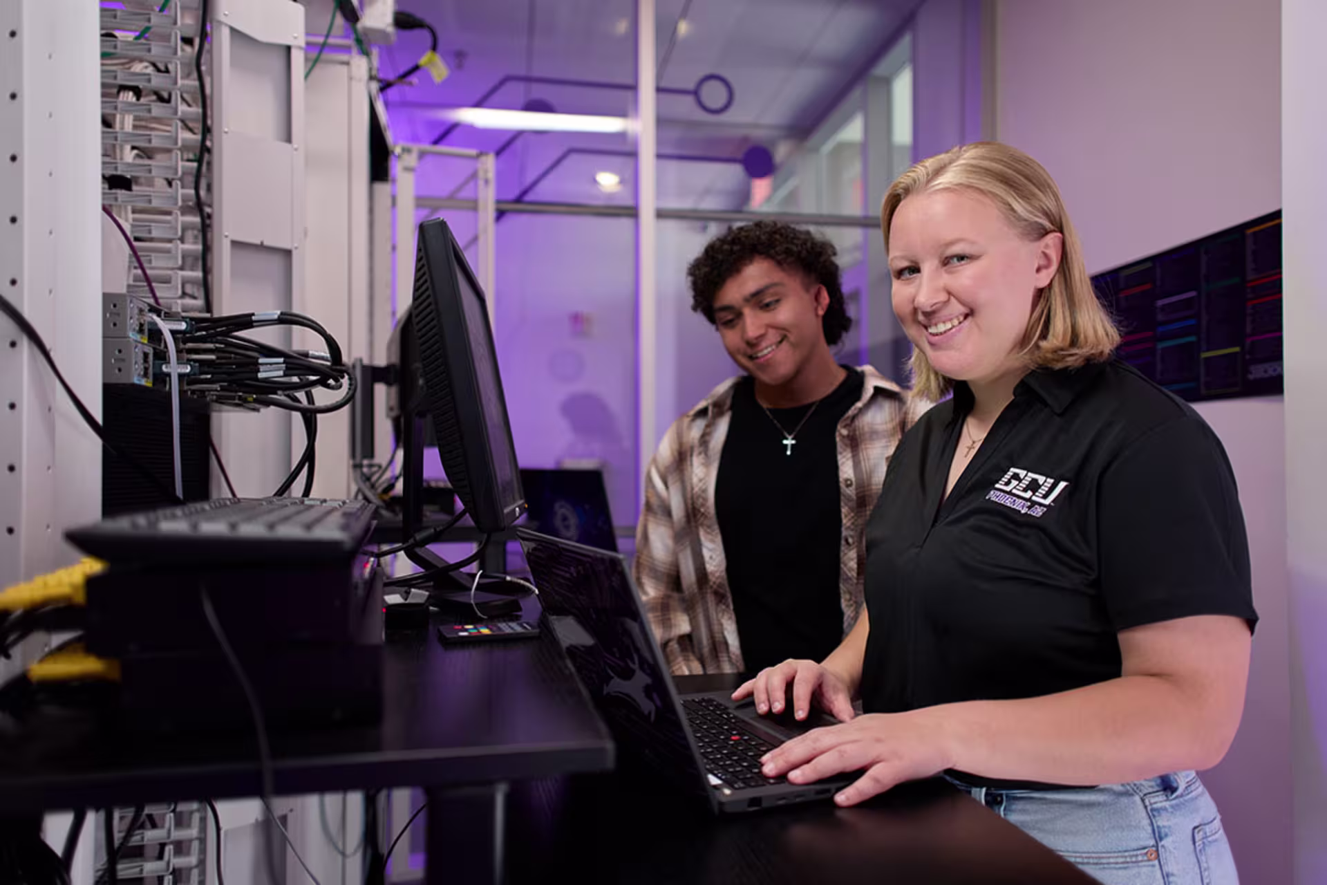 Students developing cybersecurity and technology project management skills in a hands-on learning environment.