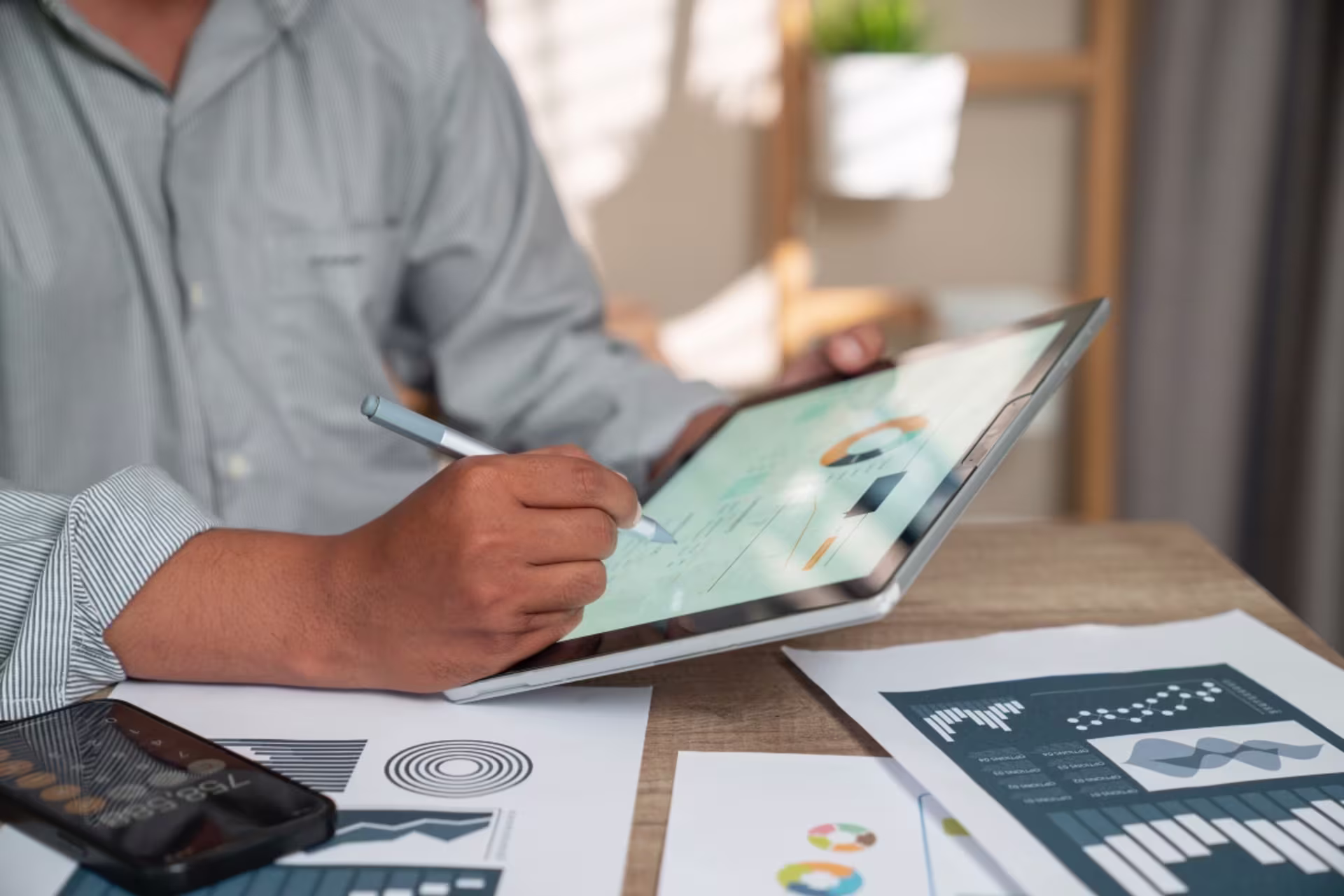 A marketing professional analyzes campaign data on a digital dashboard.
