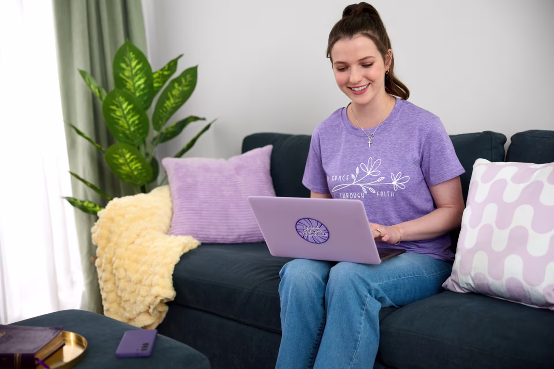 An online student in a teaching and learning program uses a laptop at home.