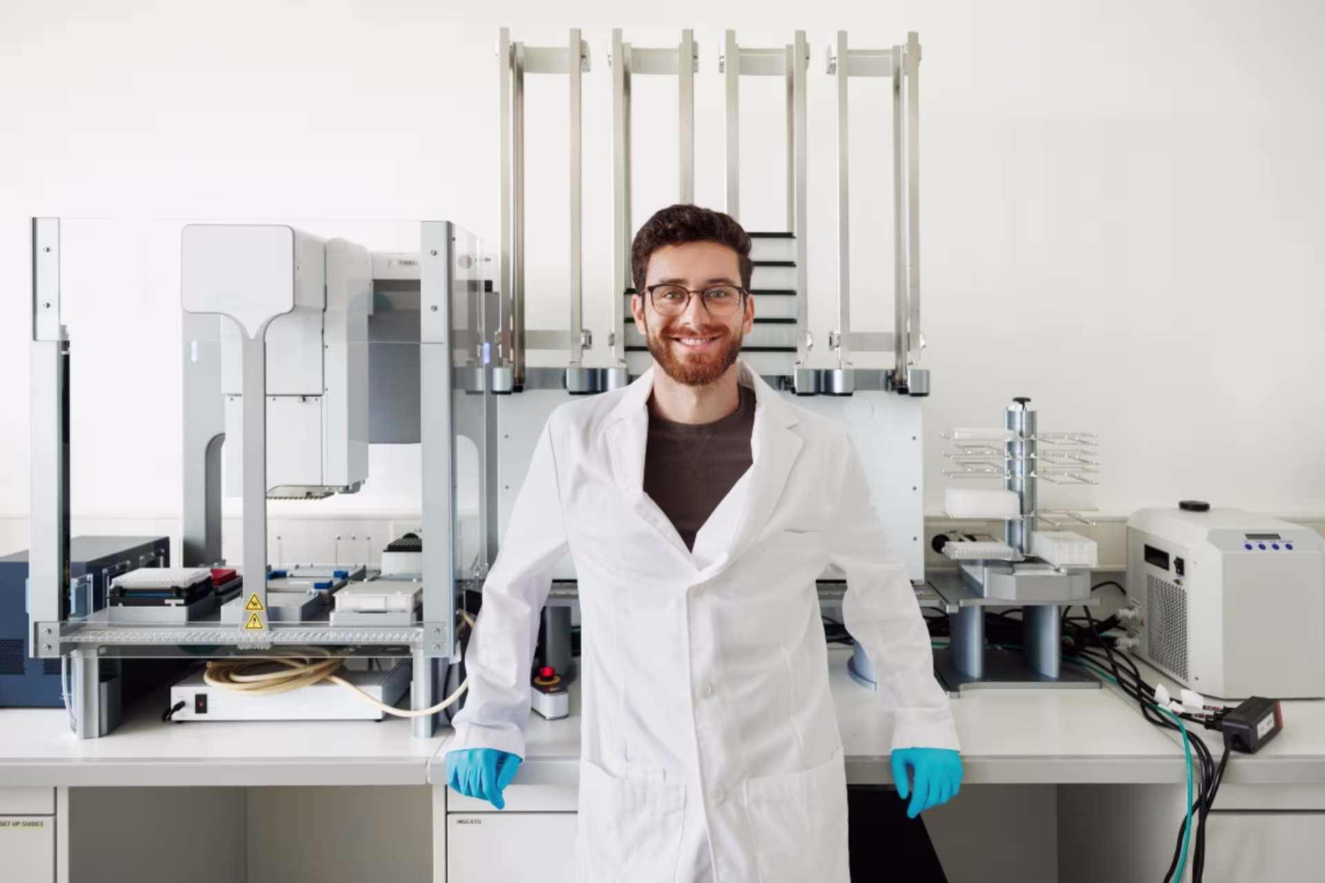 Male biological sciences student posing with laboratory equipment.