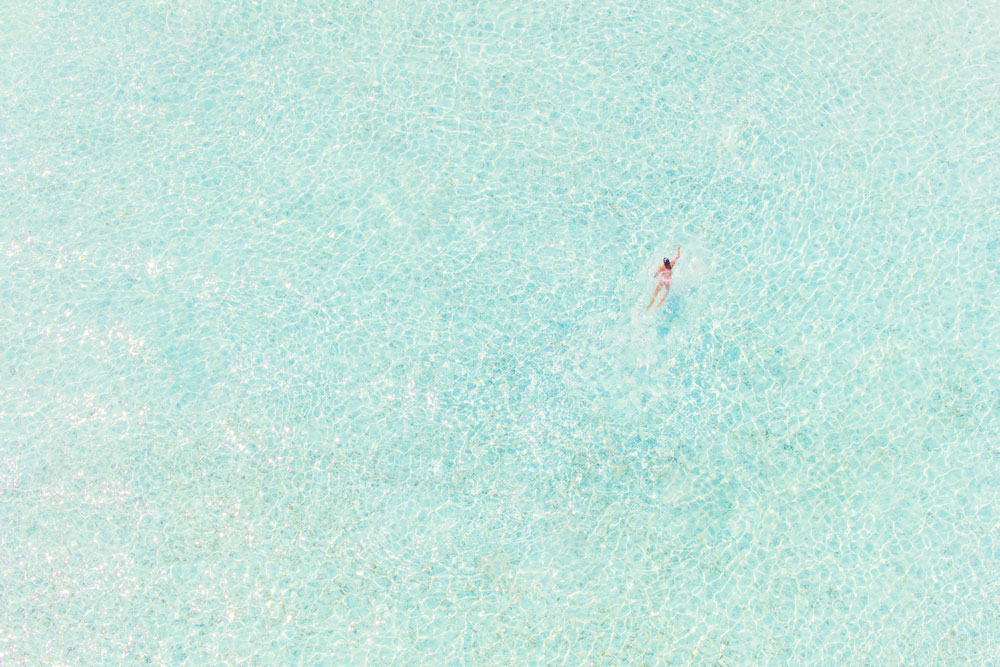 Girl in Pink, print by Gray Malin, part of his newest Bora Bora aerials collection