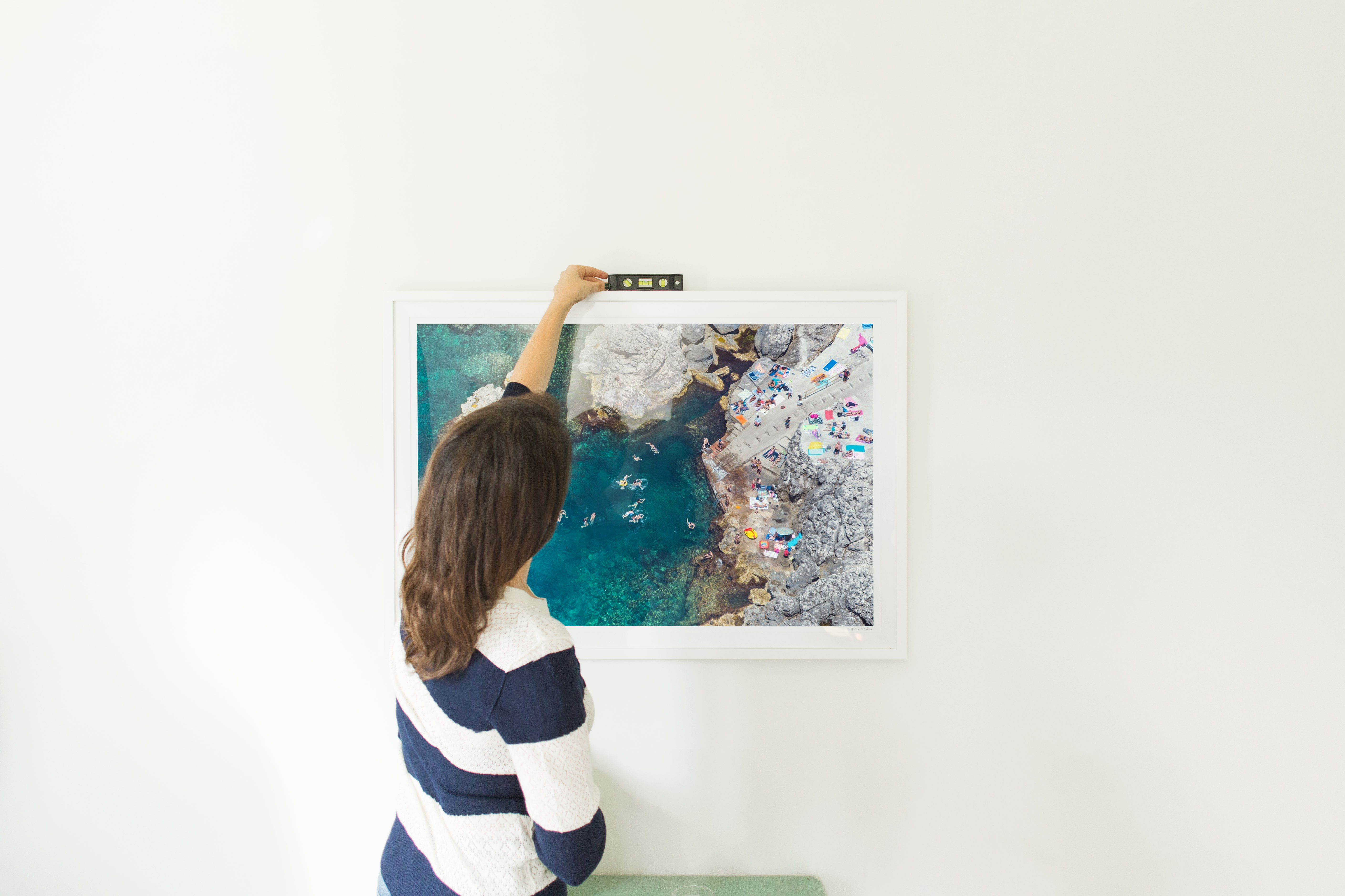 Erica Domesek and Gray Malin on Hanging Framed Artwork