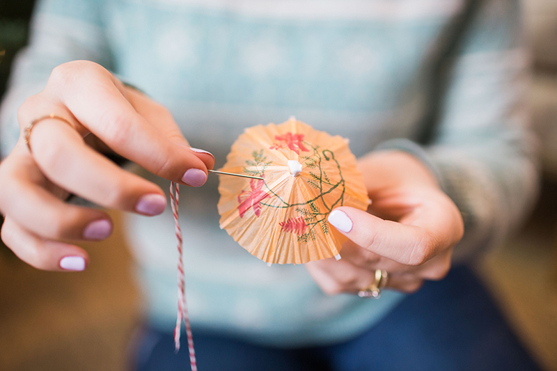 Step-by-step directions to create your own umbrella pom pom garland