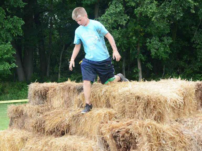 A stacked pile of hay bays in a pyramid shape