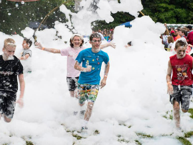 Kids running through foam