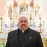Father Stokes at Holy Family Parish (Nazareth)
