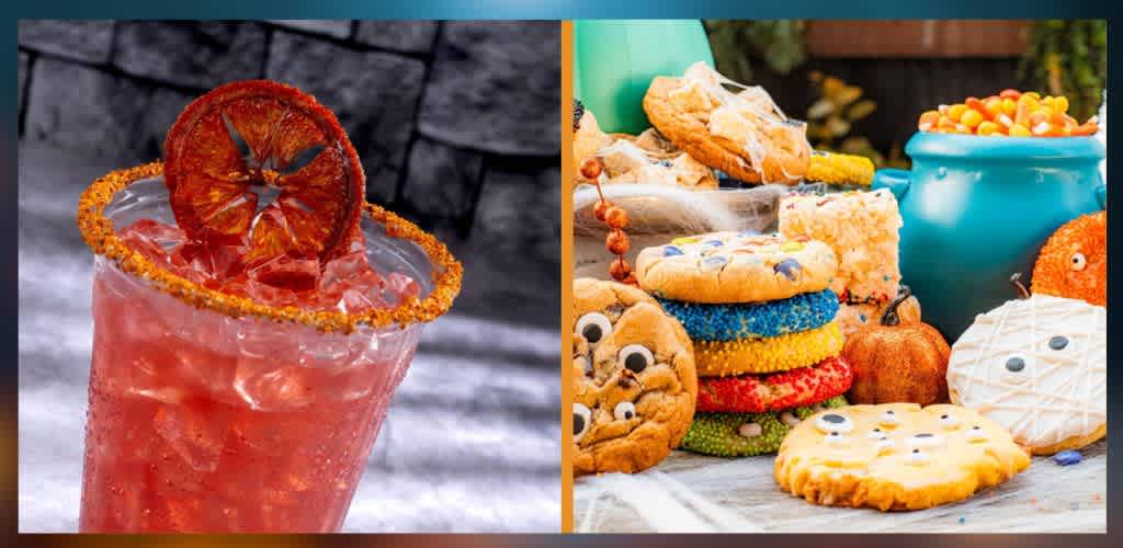 A colorful drink with ice and a dried orange slice on the rim next to a table of decorated Halloween cookies and treats.