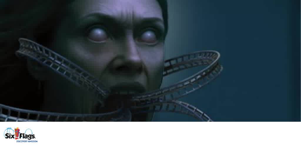 A surreal image of a face with roller coaster tracks emerging from its mouth and