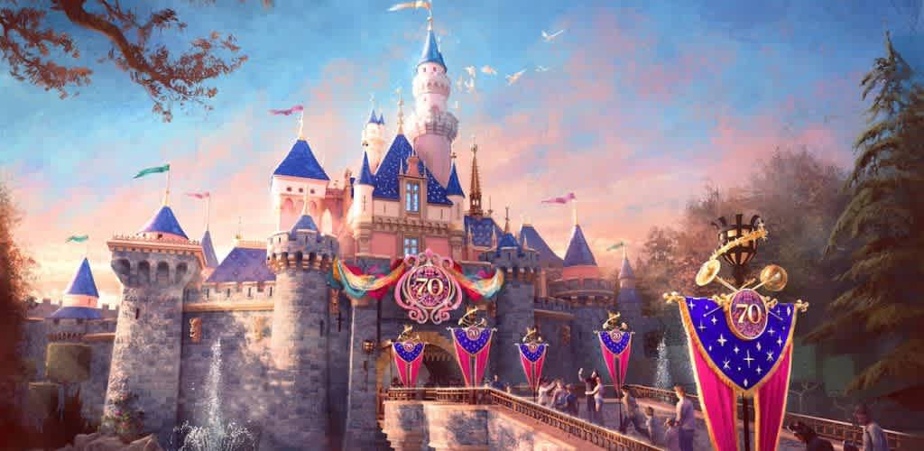 A magical castle stands bathed in the warm glow of sunset. The structure features blue and pink spires with a decorative 70th anniversary banner. Lush greenery surrounds the castle, and the sky is filled with colorful flags and distant birds. Joyful visitors are seen near the entrance, enhancing the enchanting atmosphere.