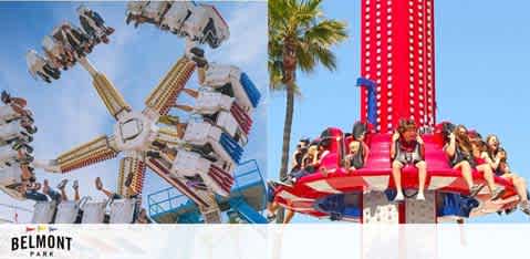 Two amusement park rides at Belmont Park under a clear blue sky. On the left, a swing ride with passengers flung outward in mid-motion. On the right, a drop tower ride with excited riders descending rapidly. Palm trees adorn the background, signifying a warm, sunny setting. The Belmont Park logo is seen at the bottom.