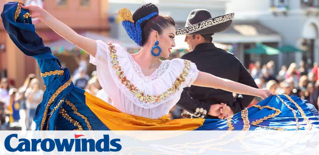 Dancers in traditional attire performing at a festival.