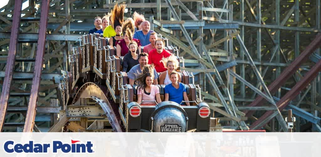 A roller coaster car filled with excited riders on the Steel Vengeance at Cedar Point.