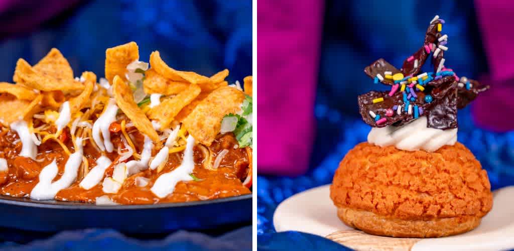 A dish of chili topped with corn chips, shredded cheese, and drizzled with white sauce is paired with a dessert featuring a bright orange cream puff topped with whipped cream, chocolate shards, and colorful sprinkles. The setting includes a vibrant blue and purple background, creating an inviting and festive atmosphere.