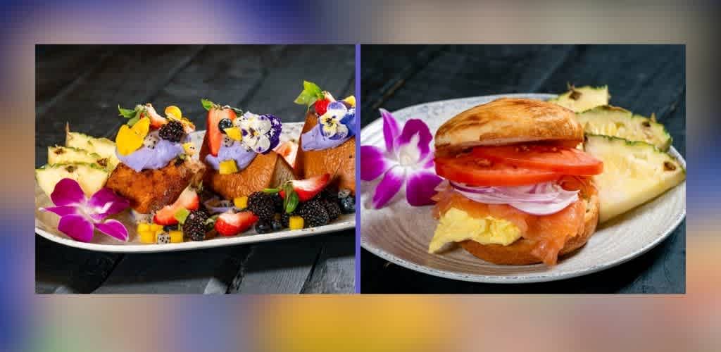 A vibrant image featuring two gourmet dishes on separate plates. The first dish showcases assorted pastries topped with colorful fruits and edible flowers, accompanied by pineapple slices and an orchid. The second dish presents a sandwich with layers of smoked salmon, scrambled eggs, tomato, and onion on a bun, garnished with pineapple slices and an orchid. Both are set on a dark wooden surface, highlighting their freshness and artistic presentation.