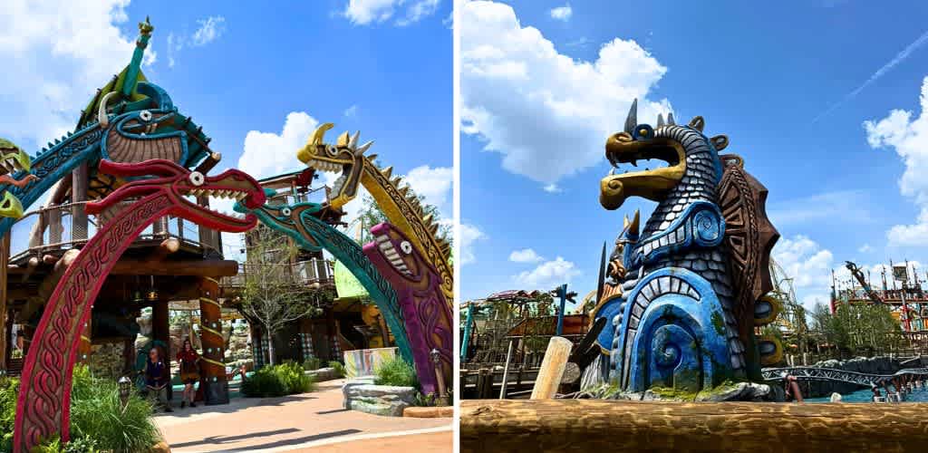 Colorful Norse dragon sculptures at a theme park with a bright blue sky and fluffy clouds in the background.