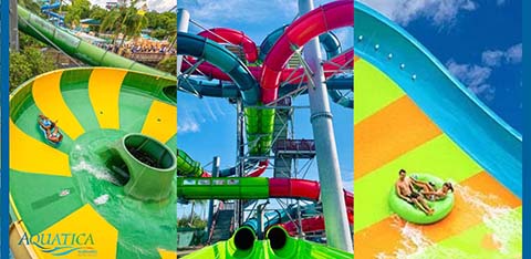Colorful water slides at a waterpark with people enjoying rides.