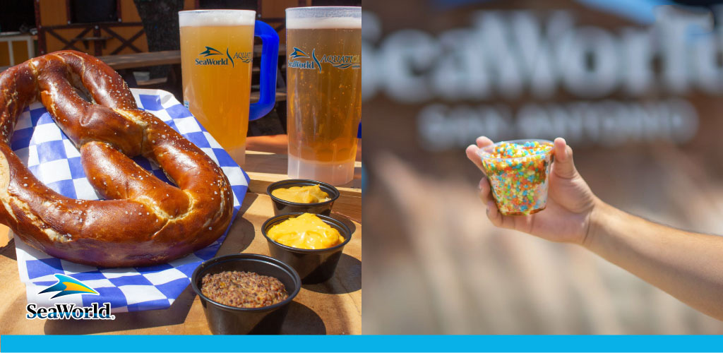 The image features a close-up view of theme park refreshments. On the left, a large pretzel with dipping sauces is displayed on a checkered paper next to two glasses of beer, all bearing the SeaWorld logo. To the right, a person's hand is holding up a small cup filled with colorful sprinkles, with the blurry park signage in the background. The warm, sunny atmosphere suggests a day of leisure at SeaWorld.