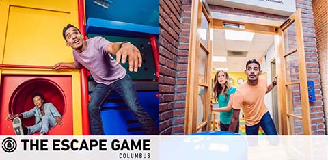 Image shows a vibrant scene at The Escape Game Columbus. A man joyfully reaches out as if trying to escape through a colorful, puzzle-like entryway. Another man watches eagerly from a circular opening, while a woman stands behind, smiling with anticipation. The setting is casual and playful, suggesting teamwork and adventure.