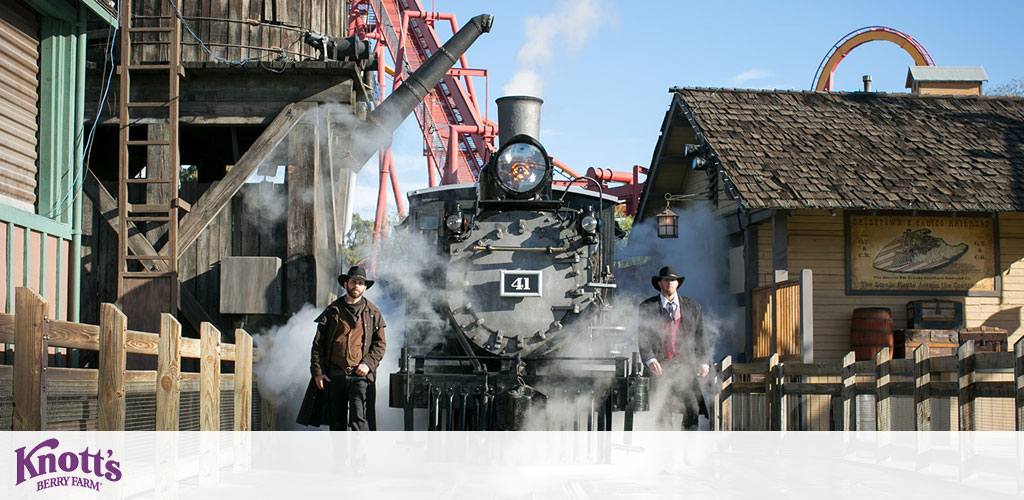 A vintage steam locomotive, labeled number 41, is billowing white smoke at Knott's Berry Farm. Two individuals in period attire stand near the train. Wooden buildings and a distant roller coaster create an Old West ambiance. The Knott's Berry Farm logo is present.