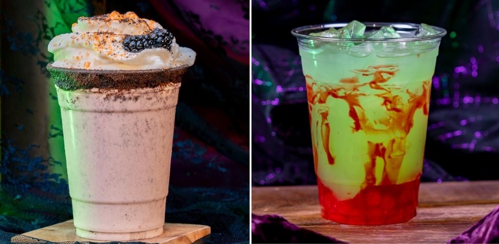 A milkshake topped with whipped cream, sprinkles, and cookie crumbs next to a colorful layered drink with green and red hues in a clear plastic cup.