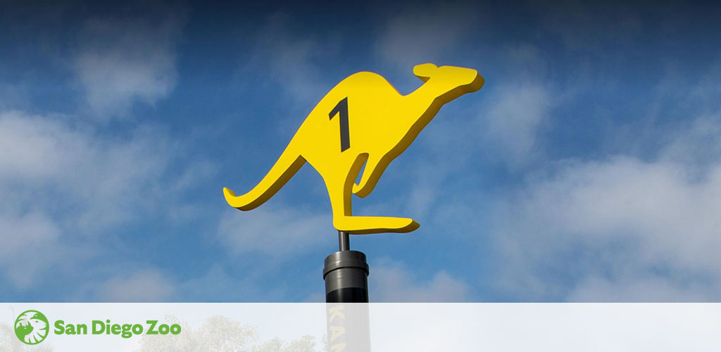 Image of a yellow kangaroo silhouette with the number 1 on it against a cloudy sky, mounted on a pole, with the San Diego Zoo logo at the bottom left corner.