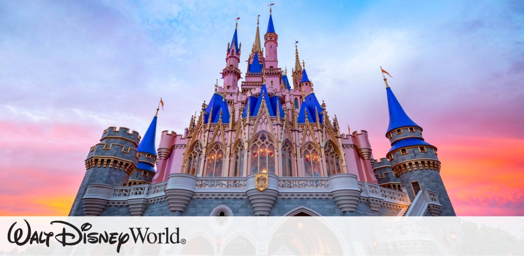 A majestic castle with tall spires and blue roofs sits under a vibrant sunset sky, blending pink, orange, and purple hues. An emblem with the words Walt Disney World is displayed at the bottom. The architecture conveys a fairytale ambiance, inviting visitors to a magical experience.