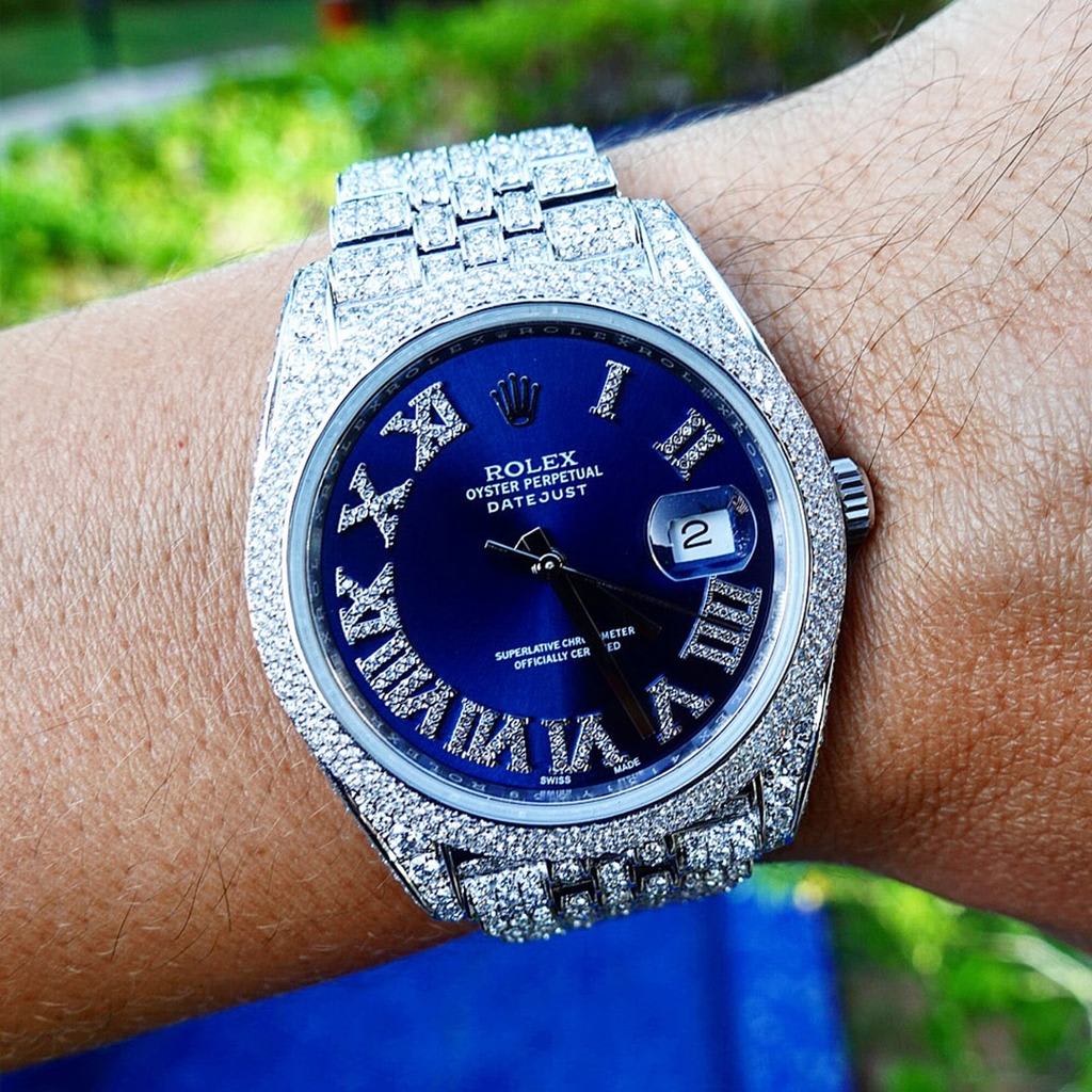 Rolex Datejust with diamonds and blue dial on wrist