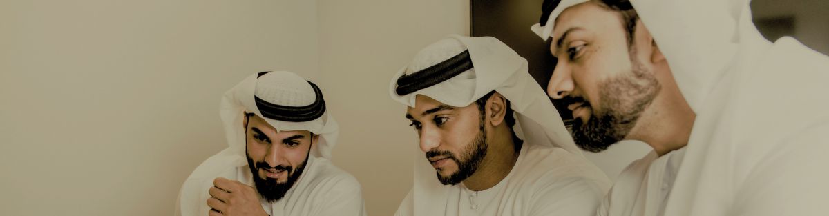 Attestation officer reviewing documents at Green Apple's Dubai clearing desk