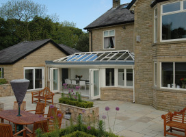 Wide T-Shape conservatory with bi-folding doors