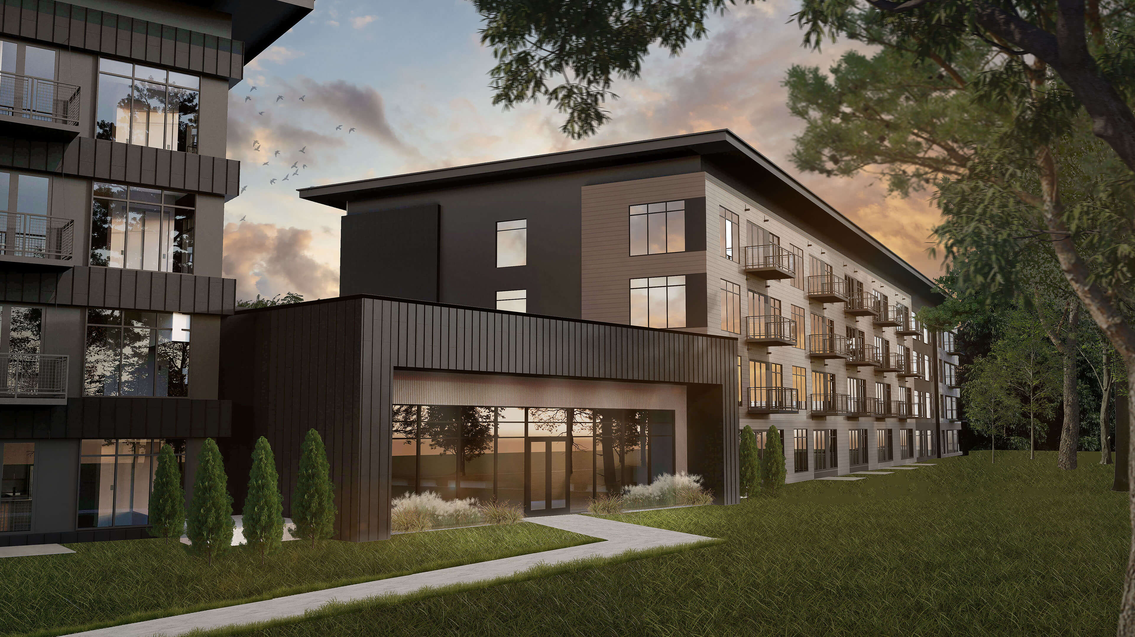 3D rendering of medium-shot of sidewalk leading to a modern-looking apartment building exterior in the evening.