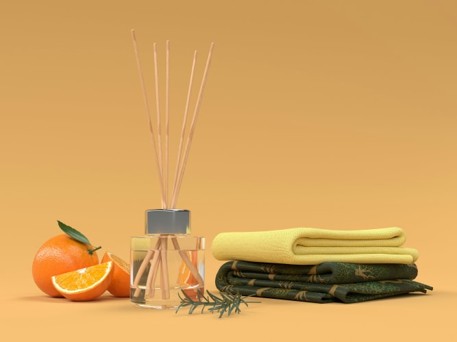 Eine Orange und Duftstäbchen auf einem Tisch null
