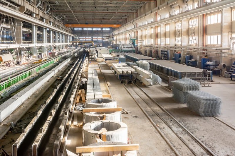 Concrete production factory with reinforced concrete elements and raw materials