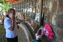 A relative of a victim cries during the commemoration of the 40th anniversary of a massacre in El Mozote.