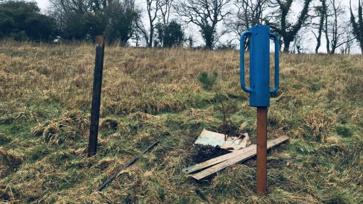 Dead hedge in process of being built, with blue hedge hammer