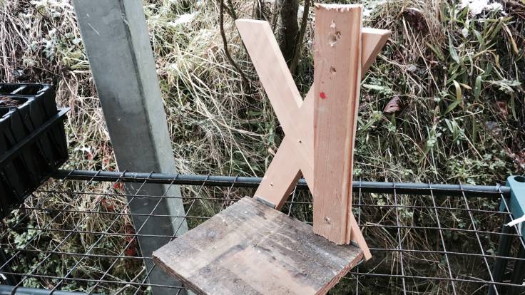 Heath-Robinsonesque wooden frame cobbled together out of bits of old wood and a bookend