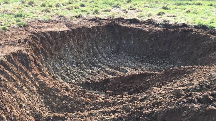 Hole in the ground for pond