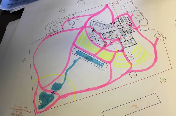 Paper print out of CAD plan with highlighter paths marked