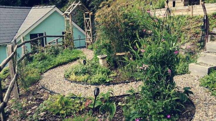 High garden, curvey path, surrounded by plants