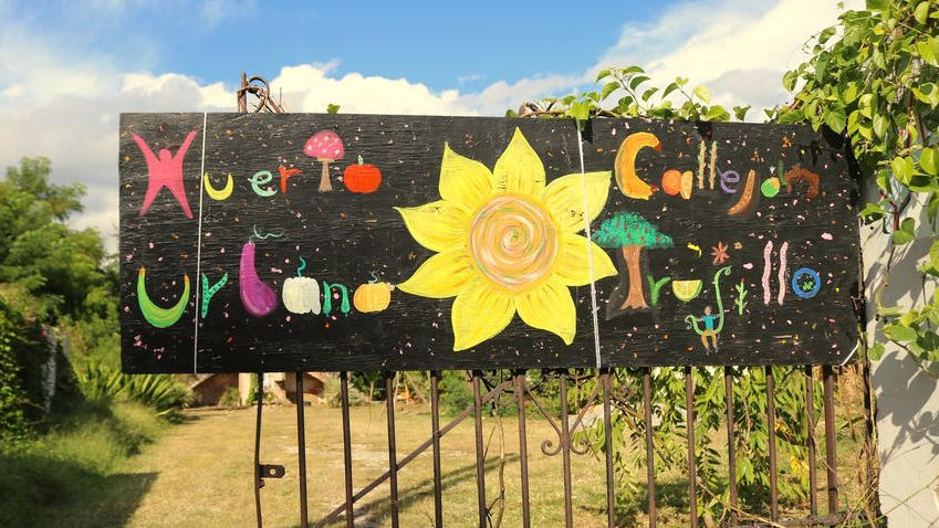 Photo of garden sign on old garden gate