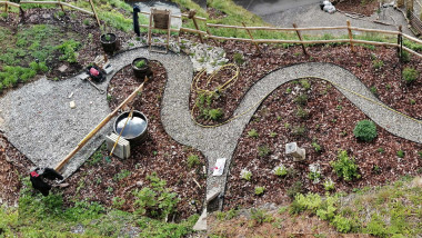 Photo from above of newly planted curvey path garden